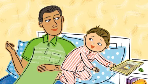 dad and son sitting on bed to read book