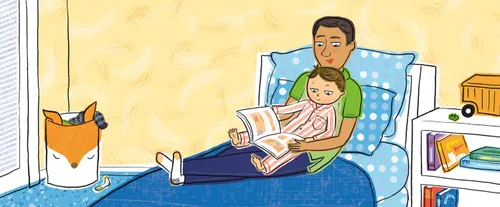 dad and son reading scripture book together