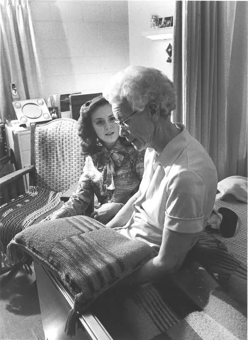 sister helping a senior