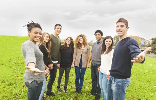 young adults with welcoming arms