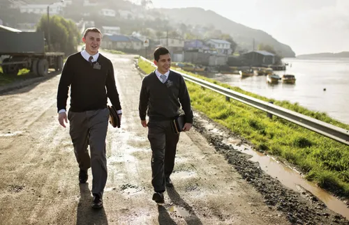 Missionaries walking down a road