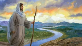 Jesus Christ is standing on a hill over looking a river