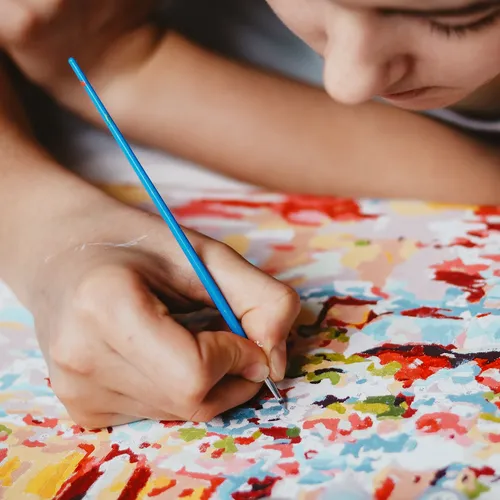 young person painting