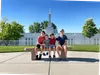 children sitting in front of temple
