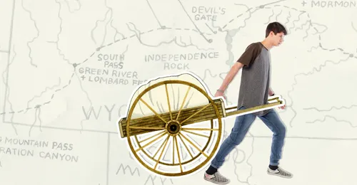 young man pulling handcart