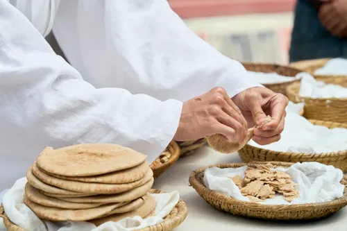 Jesus Christ breaks bread