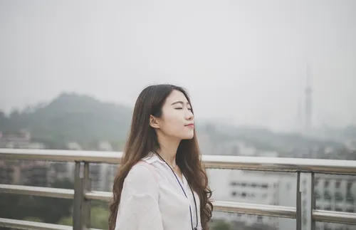 Woman with eyes closed