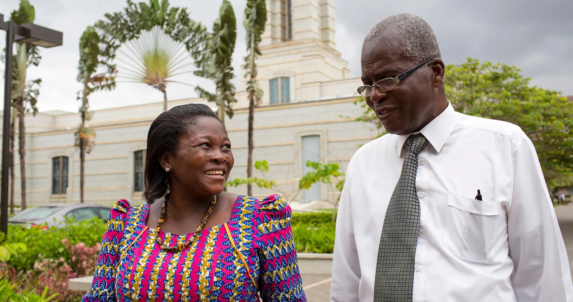 A man and woman stroll around Accra Ghana Temple.