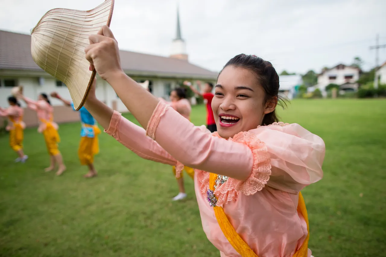 A woman smiling enjoys her family heritage