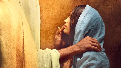 a woman being comforted by Jesus