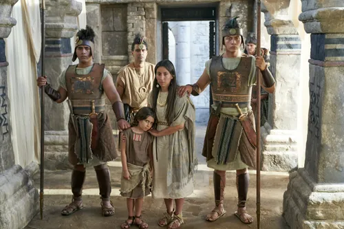 A woman and her daughter, believers in the words of Alma the Younger and Amulek, stand before a judge of Ammonihah.