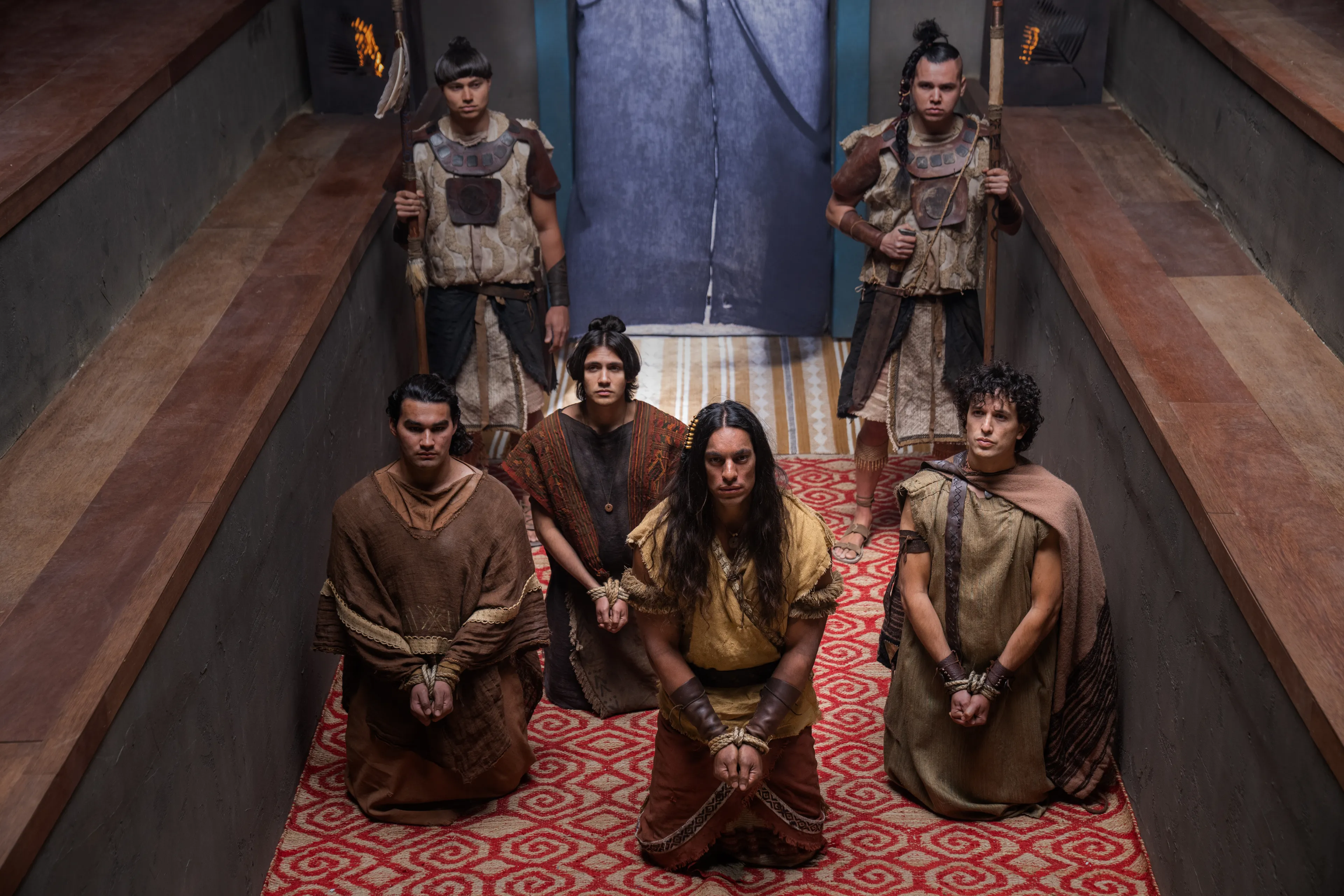 Ammon and his group of strong men are brought before King Limhi to explain why they are there.