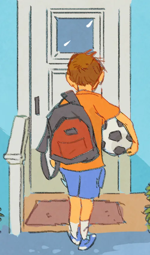Matt carrying soccer ball and walking outside
