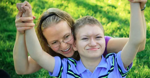 boy with disabilities with woman