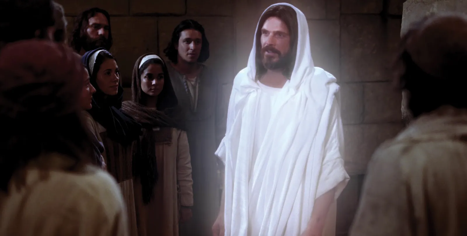 Jesus Christ, now resurrected, approaches His Apostles and others.