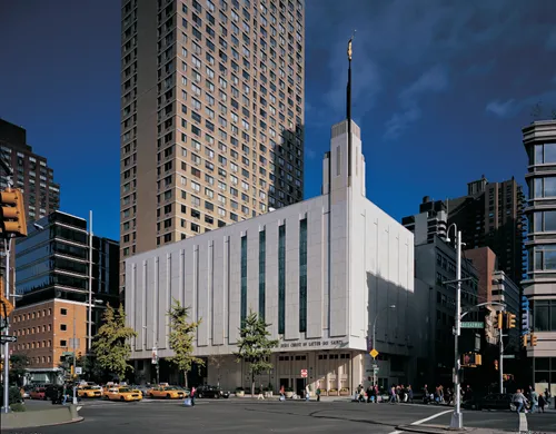A view of the front entrance and side of the Manhattan New York Temple from across the street.