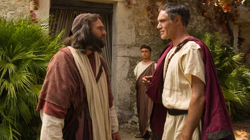 Peter speaking with Cornelius