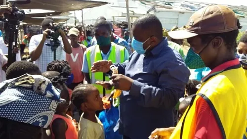 man talking to children