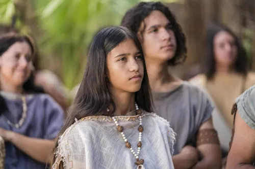 A young woman listens as Alma the Younger preaches to the people of Gideon.
