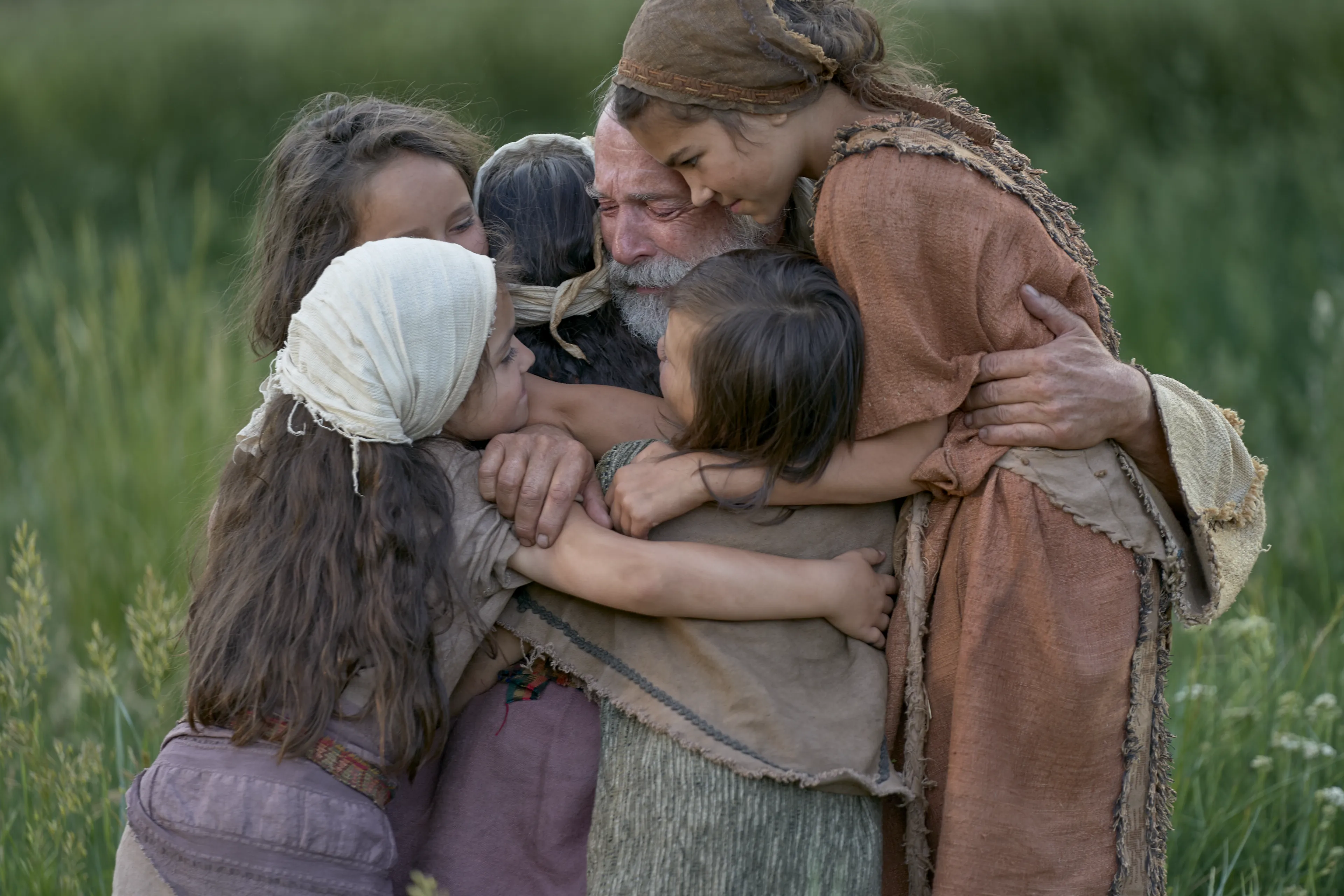 Lehi embraces his grandchildren.