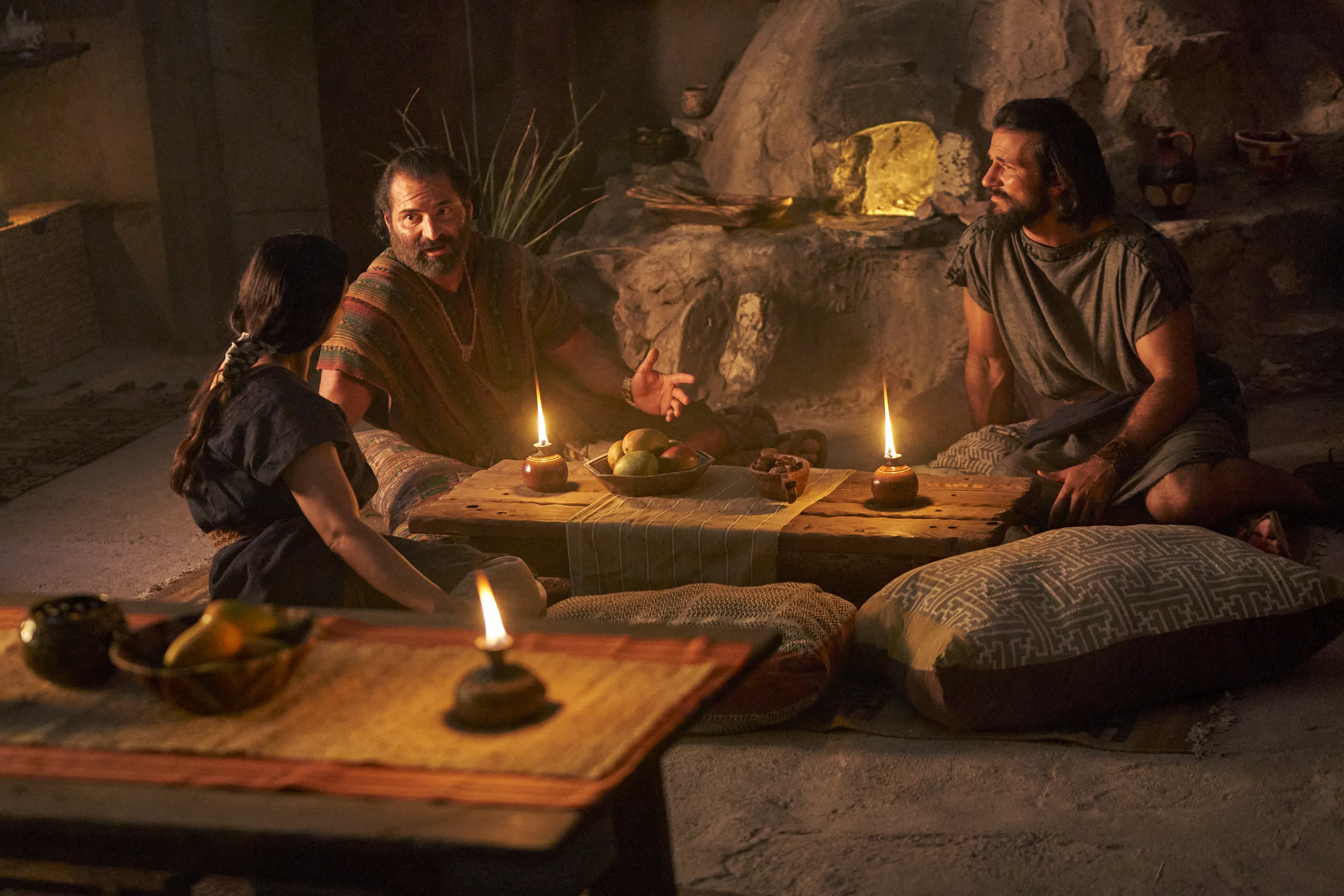 Amulek speaks to his wife as Alma the Younger listens in the city of Ammonihah.