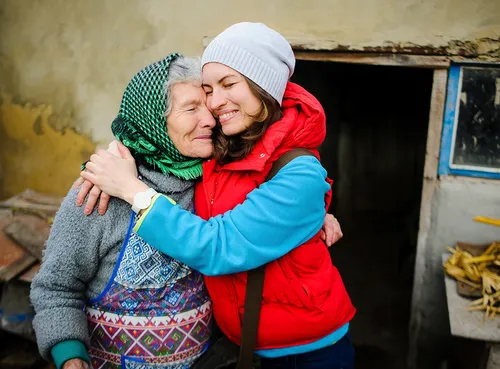 woman and older woman hugging