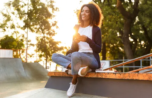 photo of a woman holding her phone
