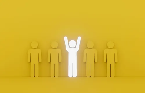 an illustration of a lit-up figure in the middle of dull figures