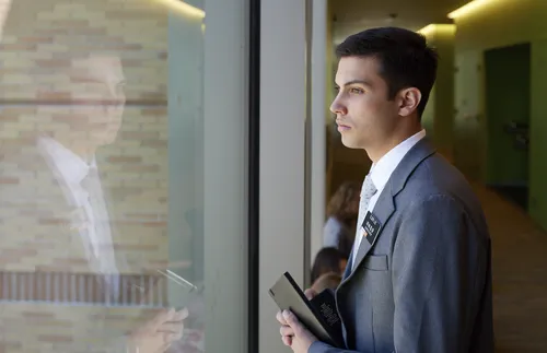Missionary looking out window