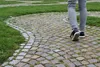 person walking on stone path