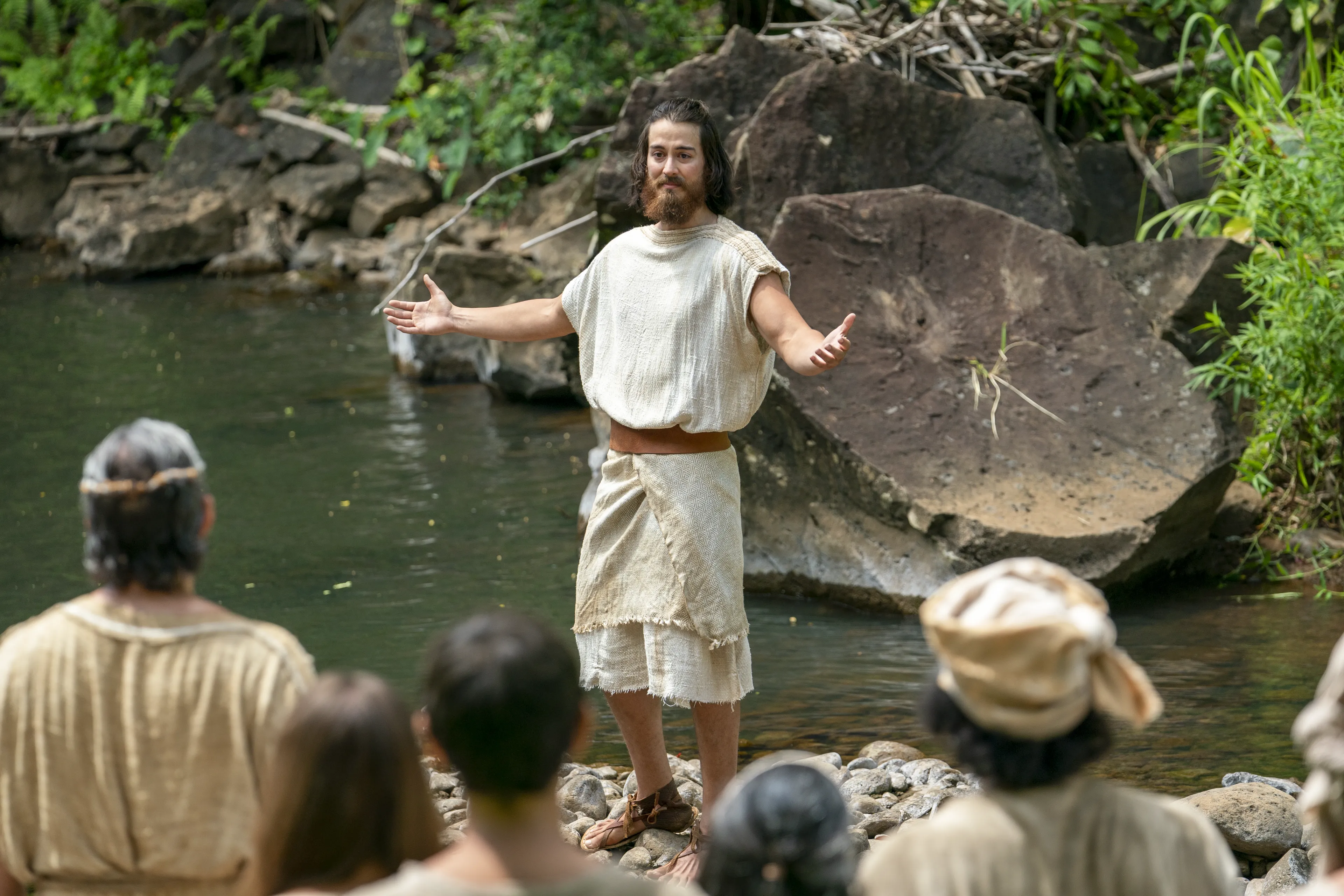 Alma prepares to baptize people at the Waters of Mormon.