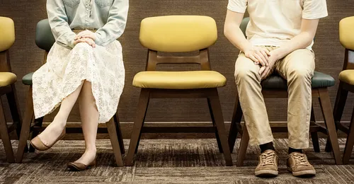 young man and youn woman sitting