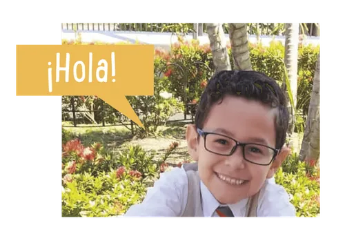 Felix smiling with a speech bubble that says ‘Hola’