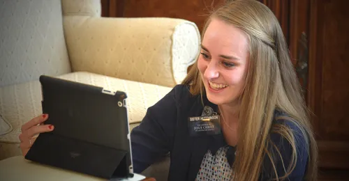 sister missionary using a tablet