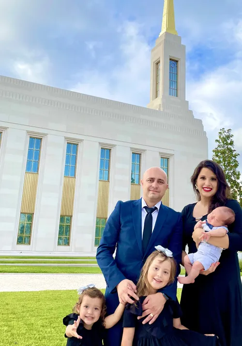 Family standing in front of the Lisbon Portugal Temple