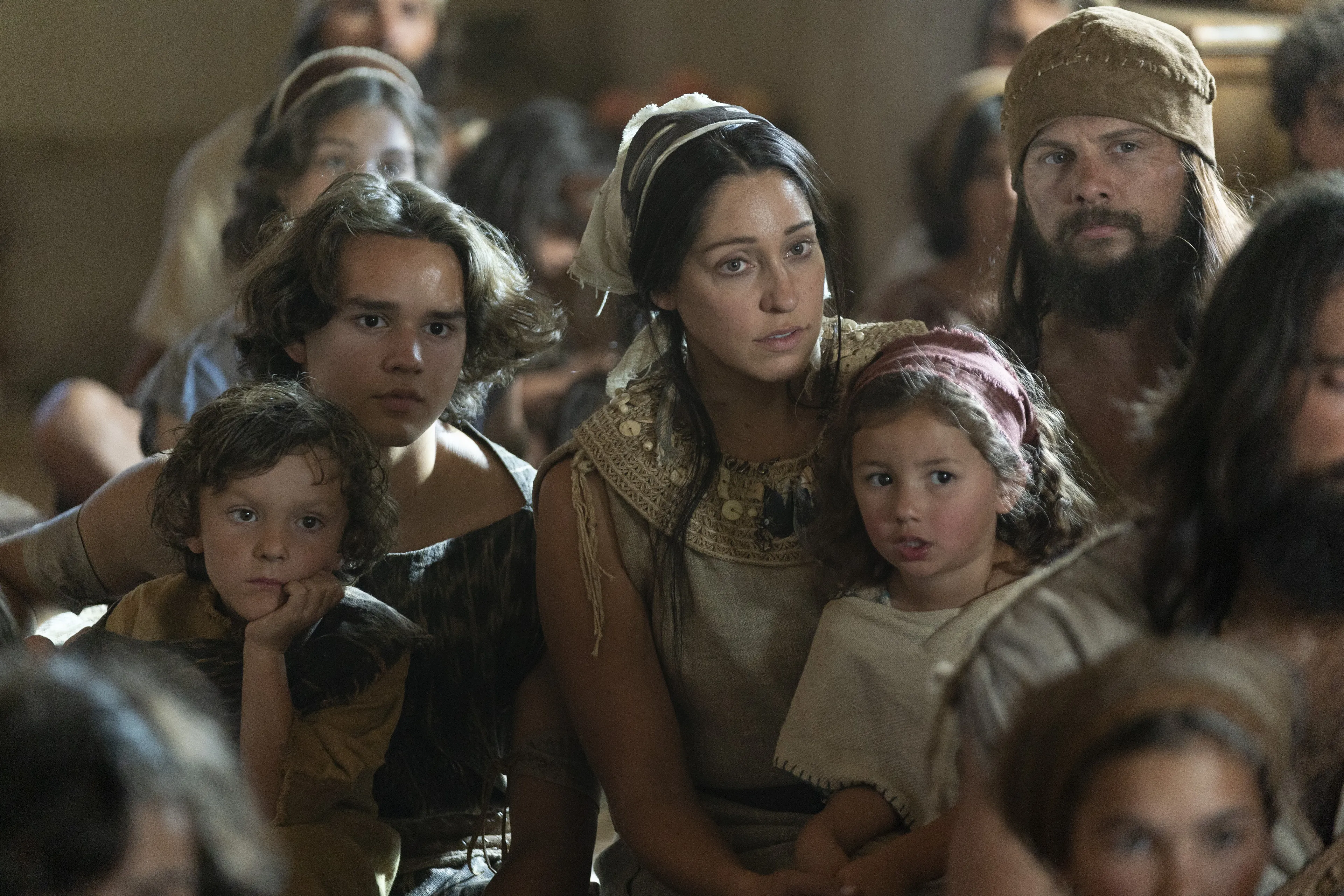 Lehi's family listens as he teaches them.