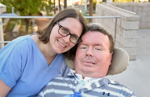 woman with her husband, a quadriplegic