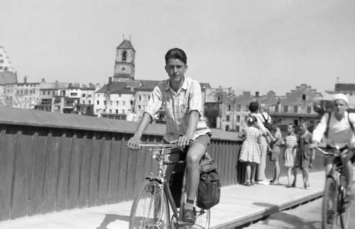 Young Elder Uchtdorf riding a bike