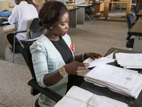 woman reading papers