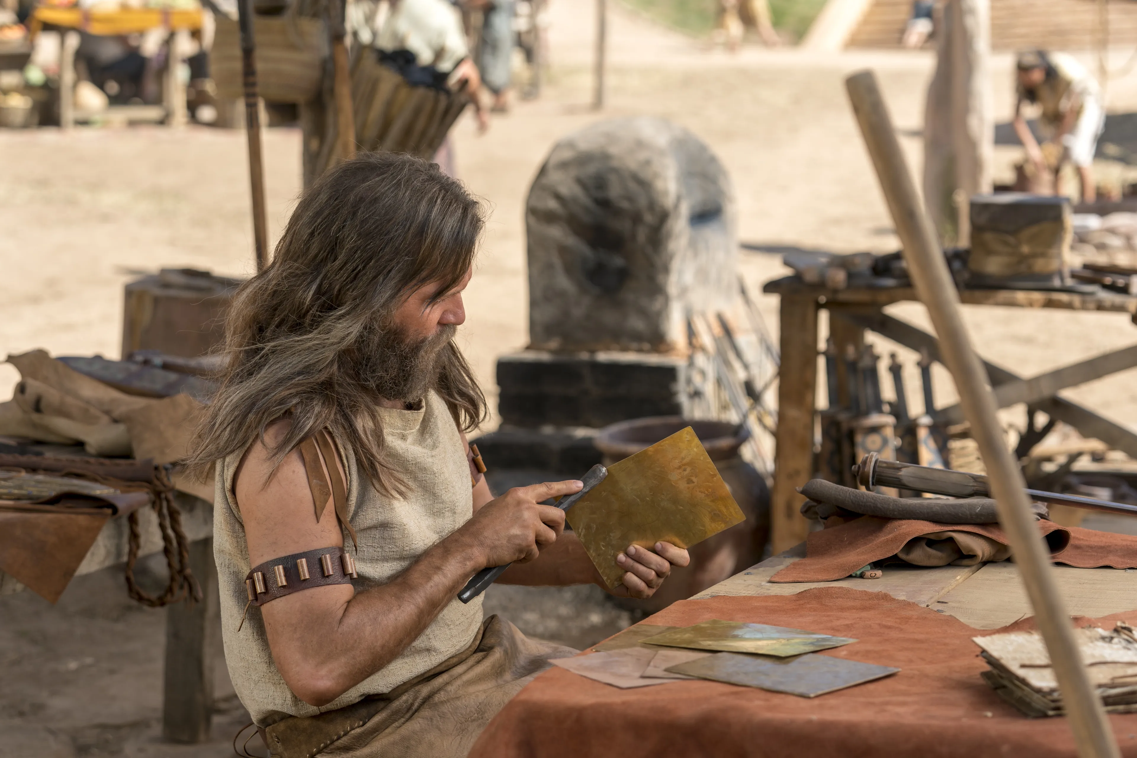 Jacob creates metal plates.