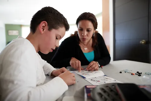 mother and son building toy
