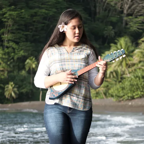 young woman playing ukulele