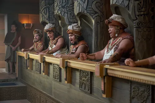 Priests gather around and watch Abinadi being sentenced to death in the court of King Noah.