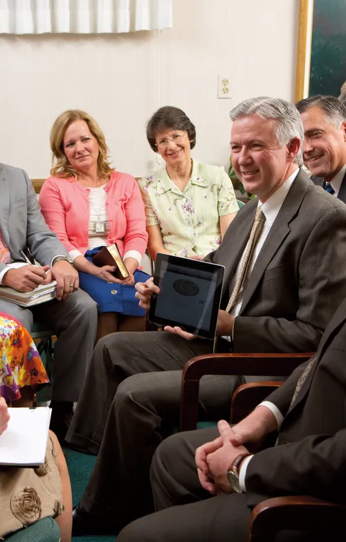 Ward council members being taught using the Worldwide Leadership Training video.