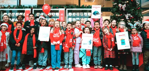 Children singing in front of Giving Machines