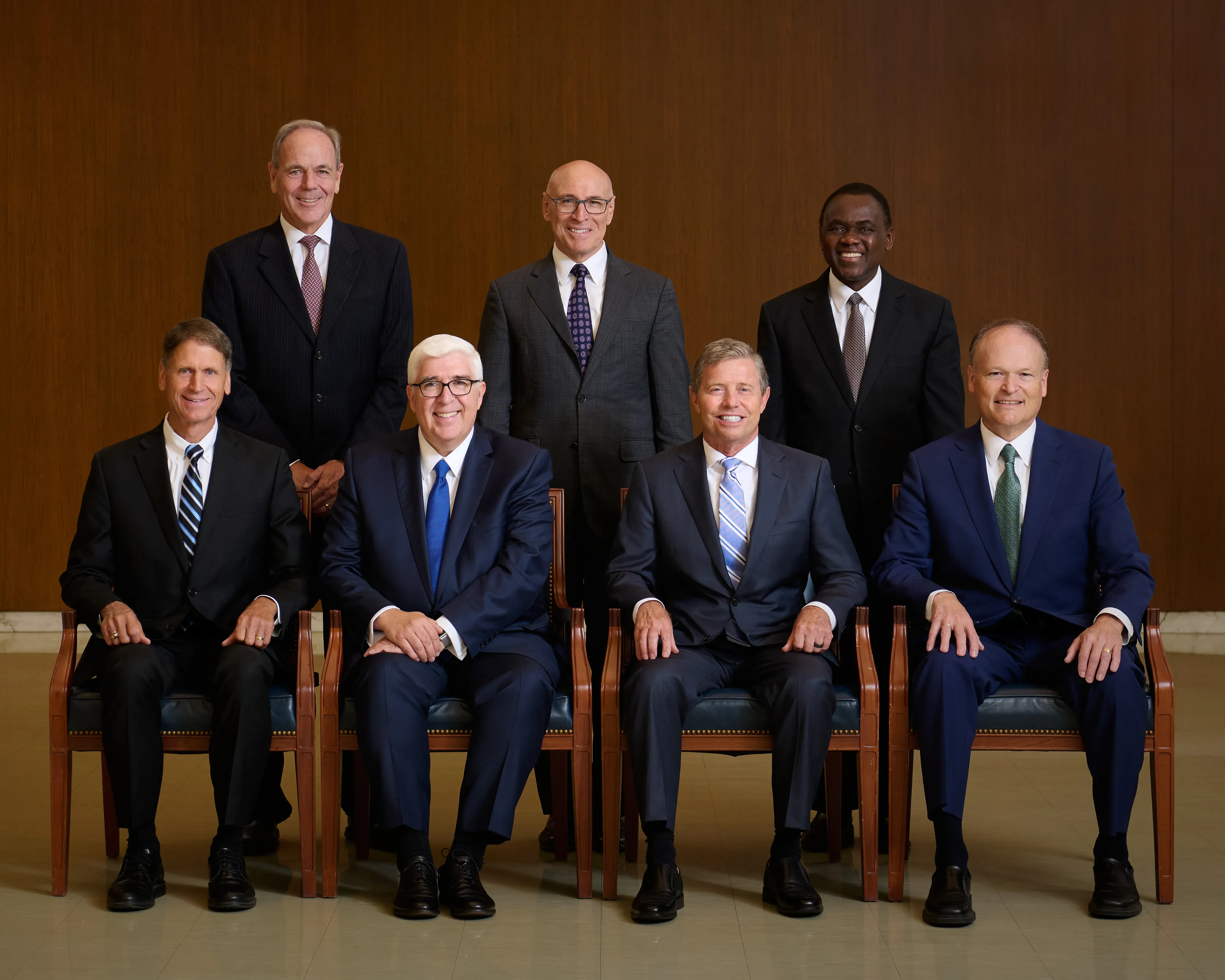 Elder Michael T. Ringwood, Elder Arnulfo Valenzuela, Elder Edward Dube, Elder Carl B. Cook, Elder José A. Teixeira, Elder S. Mark Palmer, and Elder Marcus B. Nash take a group portrait as the new Presidency of the Seventy. 