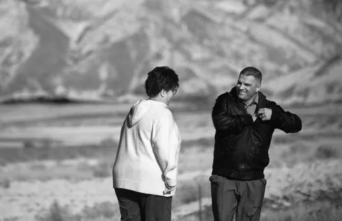 police officer greeting a woman