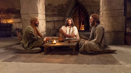 Christ sitting with the disciples.