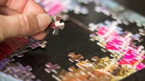 someone putting a puzzle together