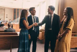 A couple talk in a chapel